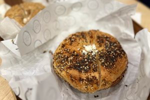 Everything bagel with cream cheese on a wrapper